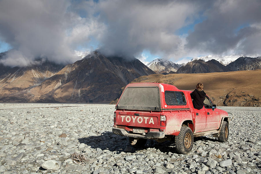 Suv Driving On Rocks With Mountains Photograph by Ubald Rutar Suv Driving On Rocks With Mountains Photograph by Ubald Rutar