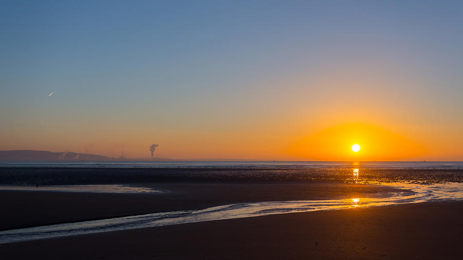 Swansea beach sunrise Photograph by Paul Cowan