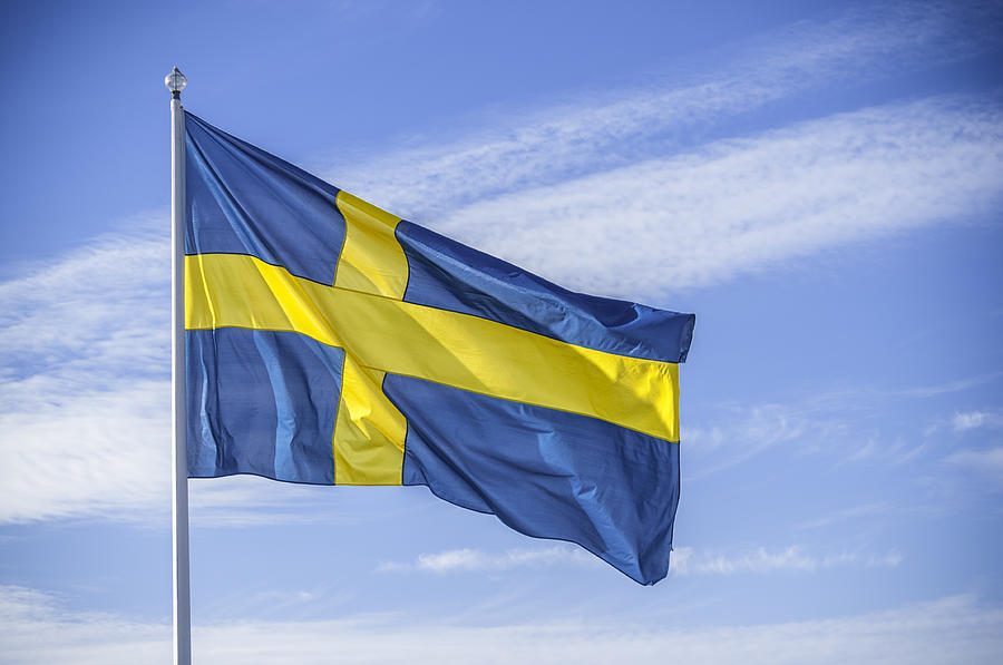 Swedish nation flag in sunlight Photograph by Martin Wahlborg