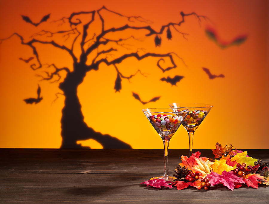 Sweets in Halloween setting with tree Photograph by U Schade