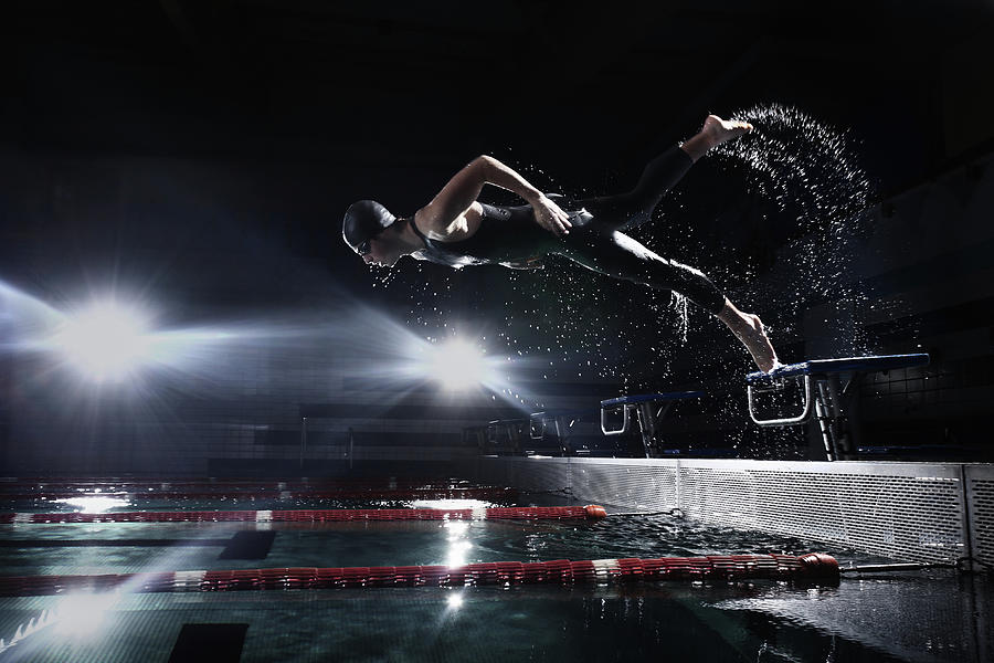 Swimmer Jumping From Starting Platform Photograph by Stanislaw Pytel