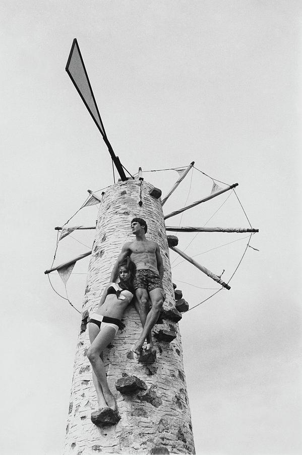 Swimwear Models Posing On A Windmill Photograph by Leonard Nones