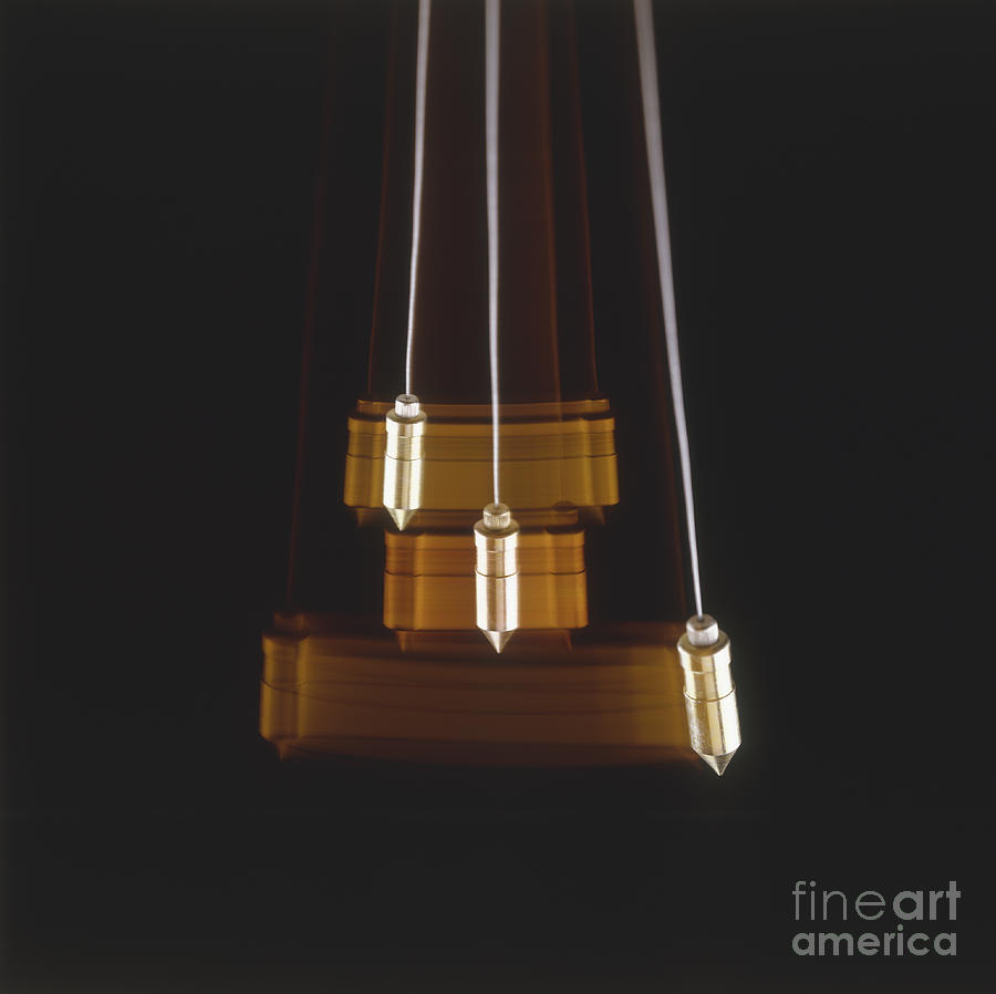 Swinging Pendulum Photograph by Mike Dunning / Dorling Kindersley