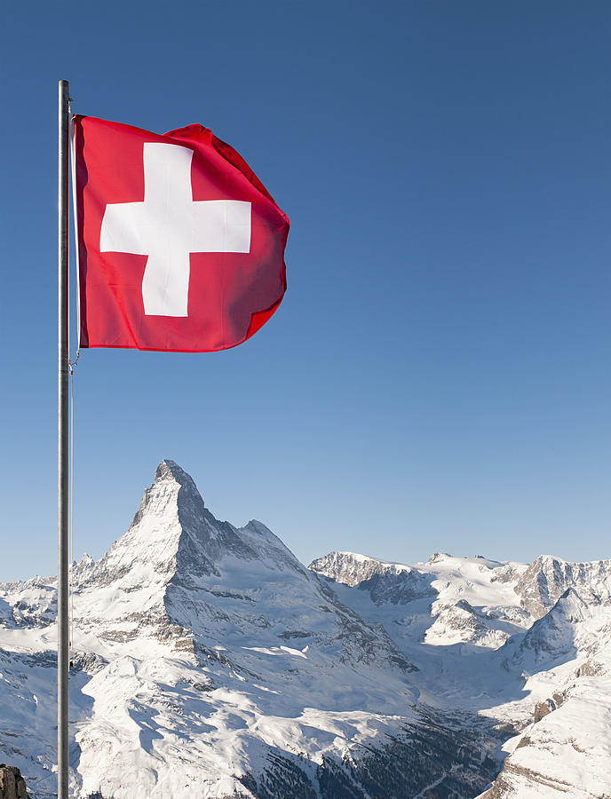 Swiss Flag and Matterhorn Photograph by Georgeclerk
