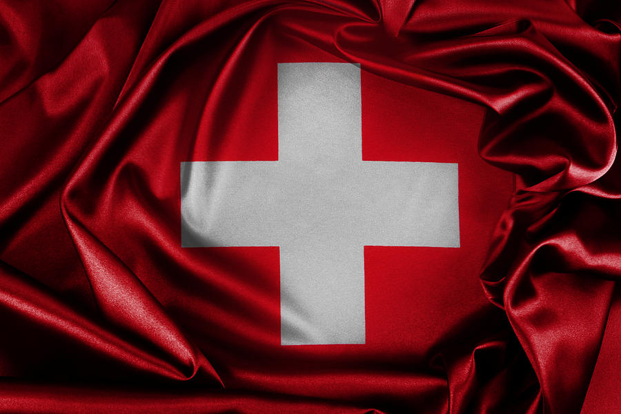 Abstract Photograph - Switzerland flag by Les Cunliffe