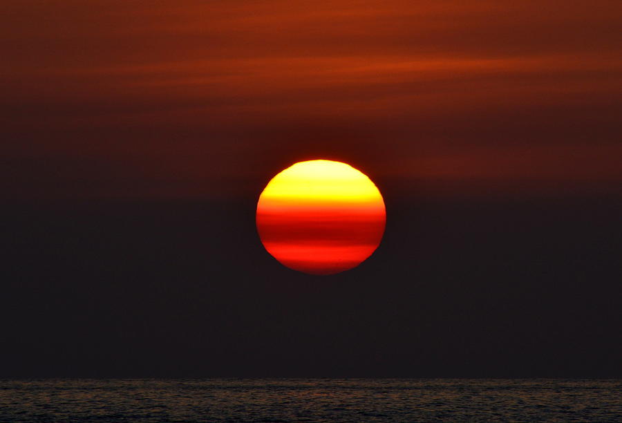 Swollen Sun Photograph by Lori Seaman
