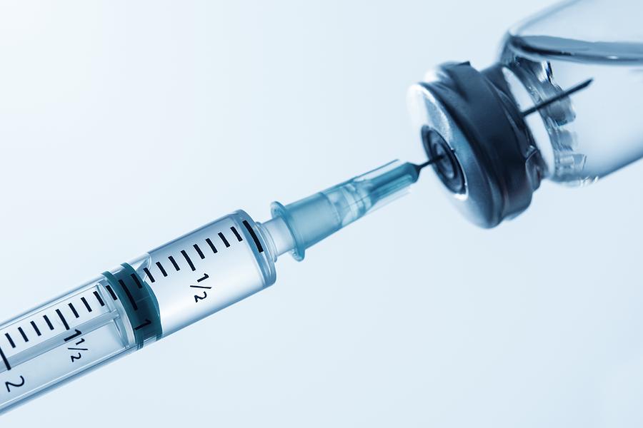 Syringe being filled Photograph by Science Photo Library
