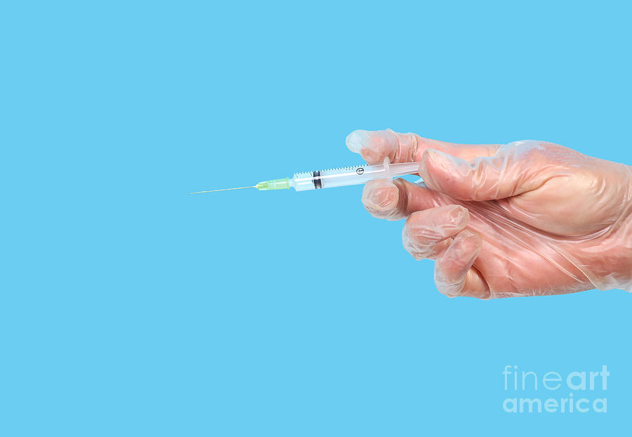 Syringe in hand Photograph by Patricia Hofmeester