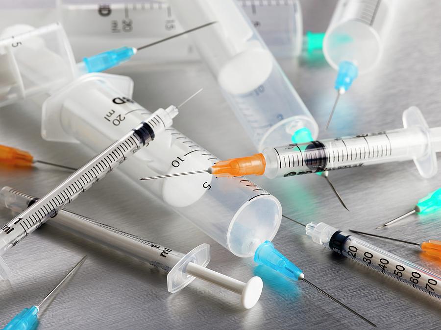 Syringes And Needles by Science Photo Library