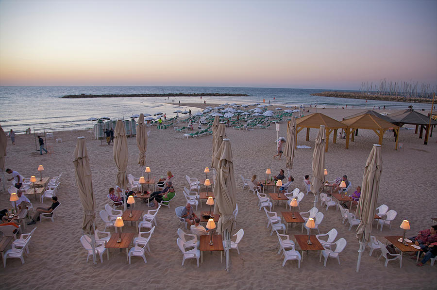 Tables And Chairs On Beach At Dusk Photograph by Barry Winiker