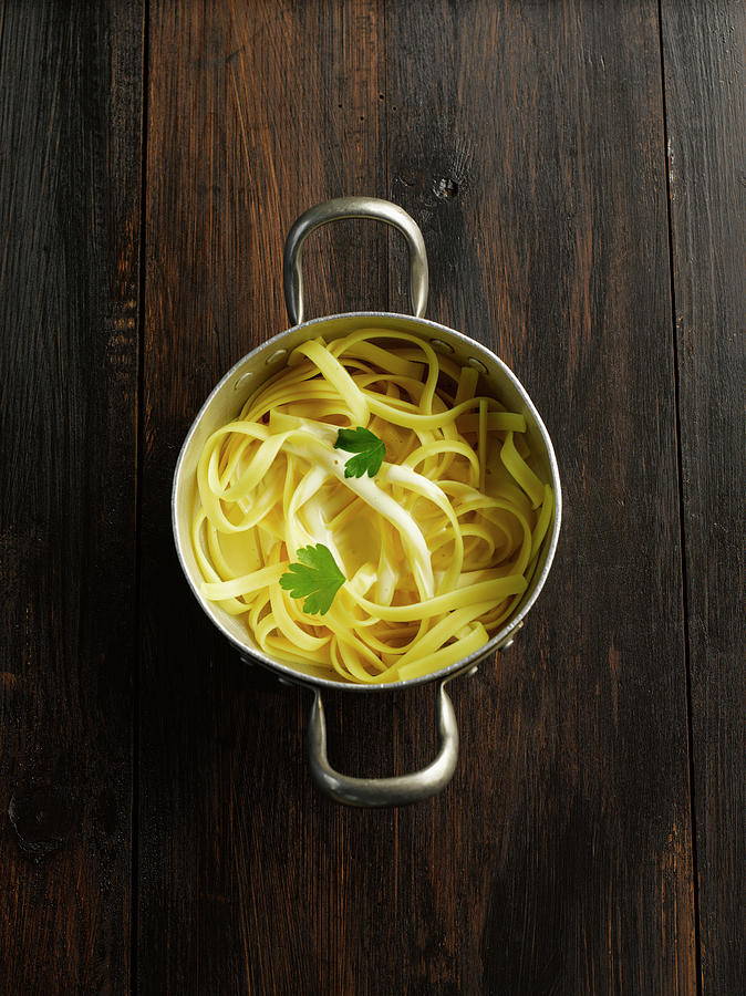 Tagliatelle In Pot On Table Photograph by Westend61