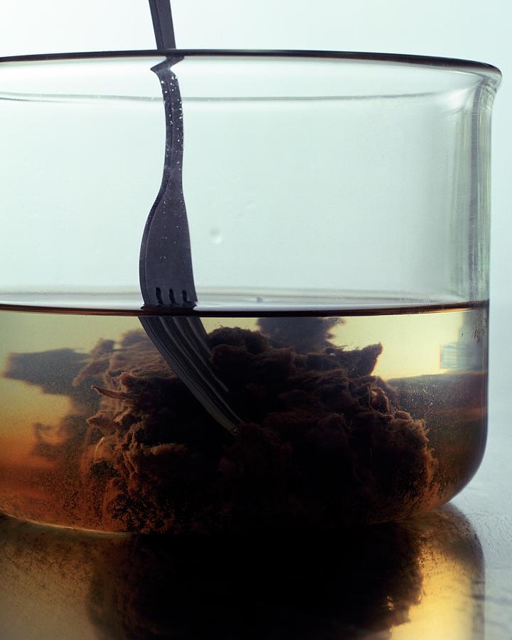 Tamarind Powder Floating In Water Photograph by Romulo Yanes