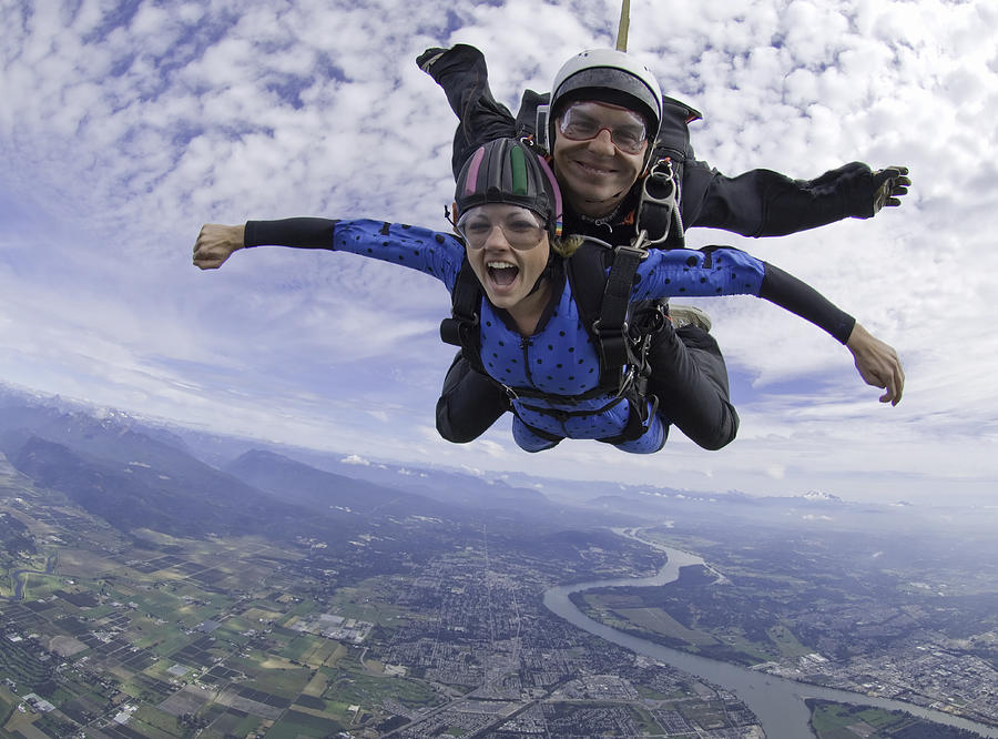Tandem skydivers in freefall Photograph by Darryl Leniuk