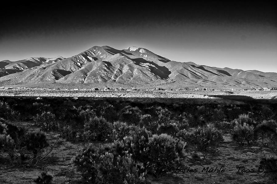 Taos in black and white X Photograph by Charles Muhle
