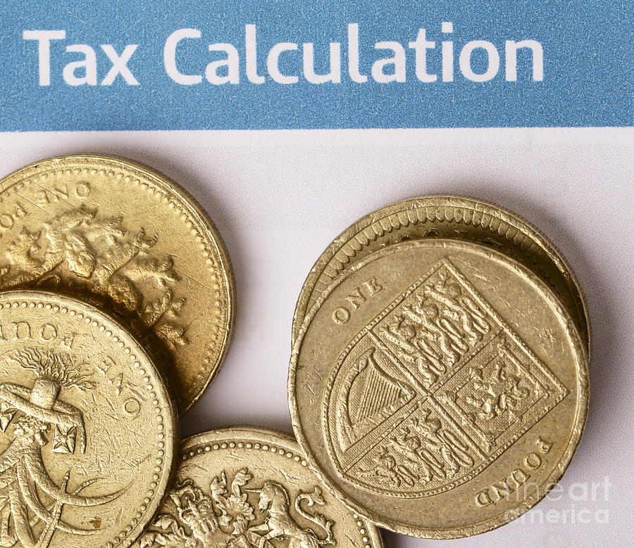 Tax calculation Photograph by Paul Cowan