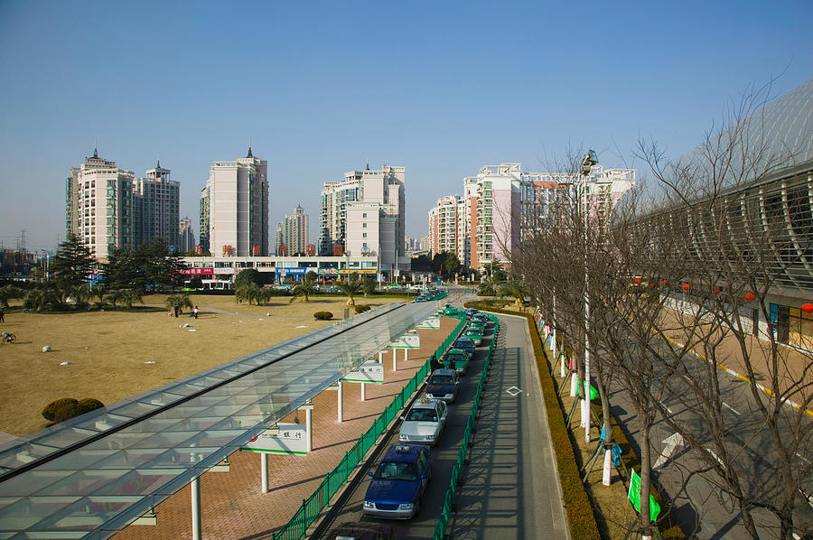 Architecture Photograph - Taxis Parked Outside A Maglev Train by Panoramic Images