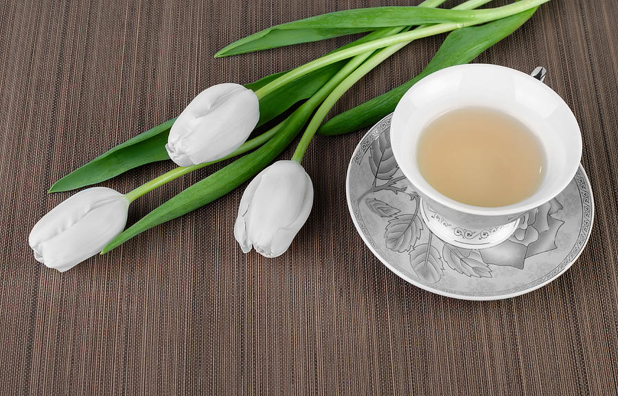 Tea Photograph - Tea and tulips by Evgeni Ivanov