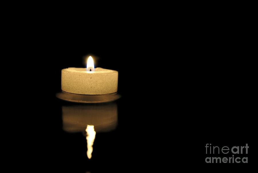 Tea candle in the water Photograph by Martin Capek