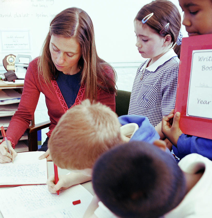 Teacher Marking Work Photograph by Martin Riedl/science Photo Library
