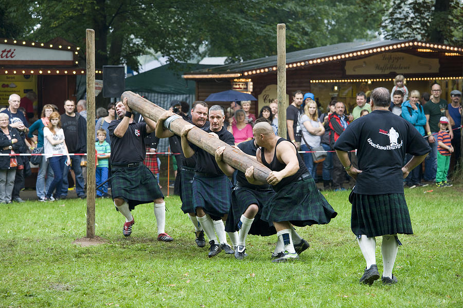team of strong men athletes at Highland Games in Trebsen Photograph by Philartphace