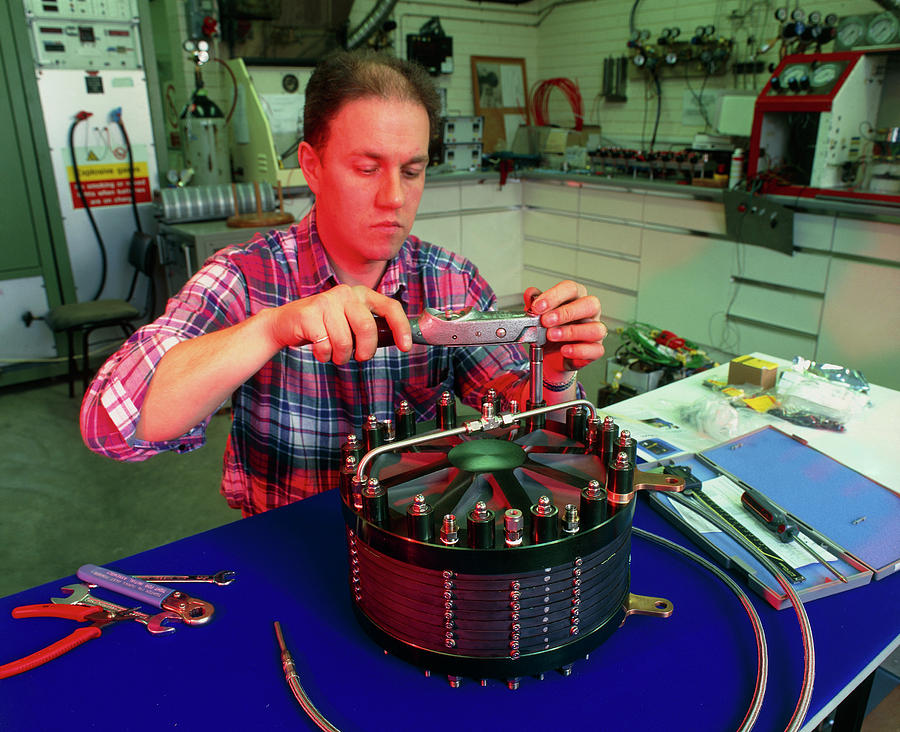 Technician Assembling A Solid Polymer Fuel Cell Photograph by Martin Bond/science Photo Library