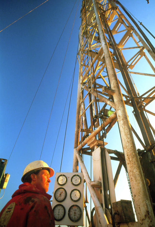 Technician At An Onshore Gas Drilling Rig Photograph by Chris Knapton/science Photo Library
