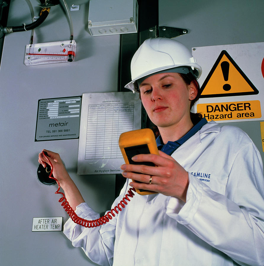 Technician Monitoring Pollutant Levels In Air Photograph by Jerry Mason