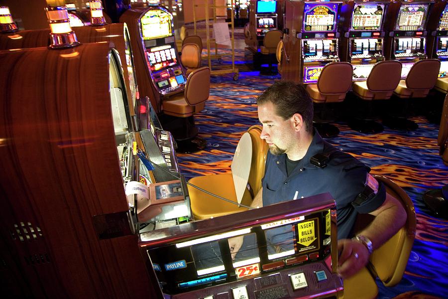 Technician Servicing A Slot Machine Photograph by Jim West