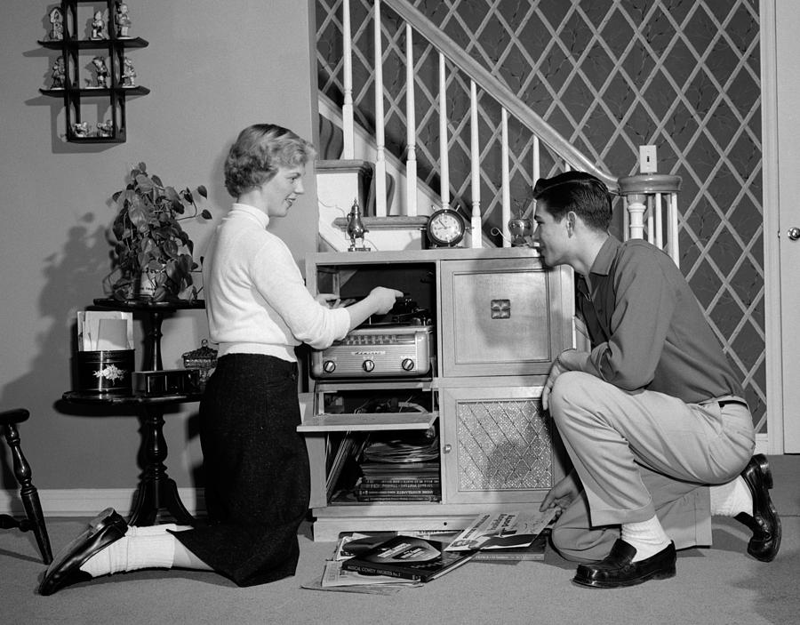 Teen Couple Playing Records, C.1950s Photograph by H. Armstrong Roberts/ClassicStock