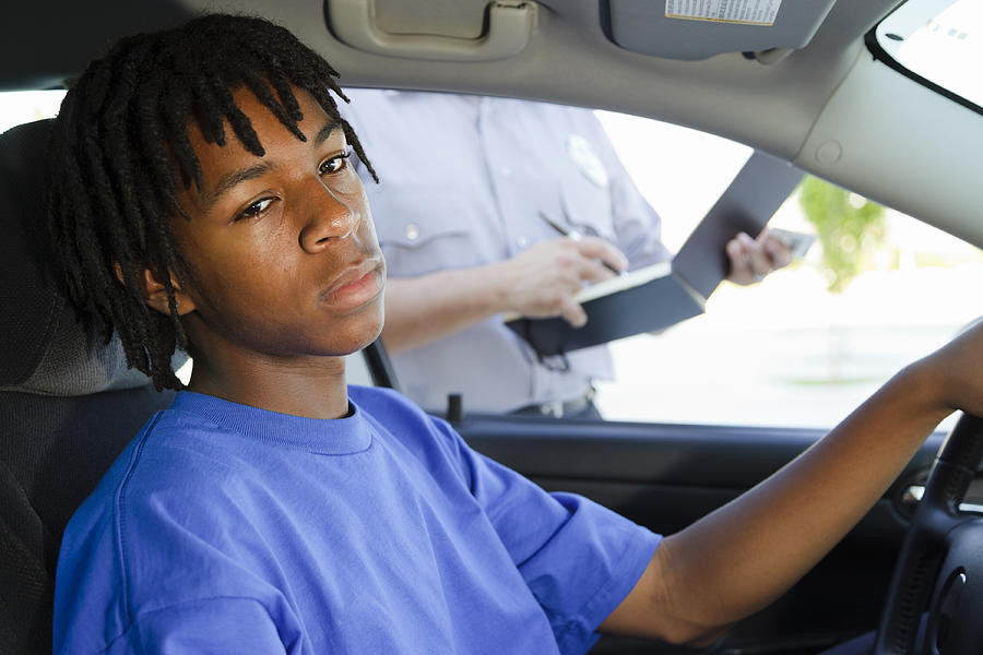 Teenage Boy Receiving a Ticket Photograph by RichLegg