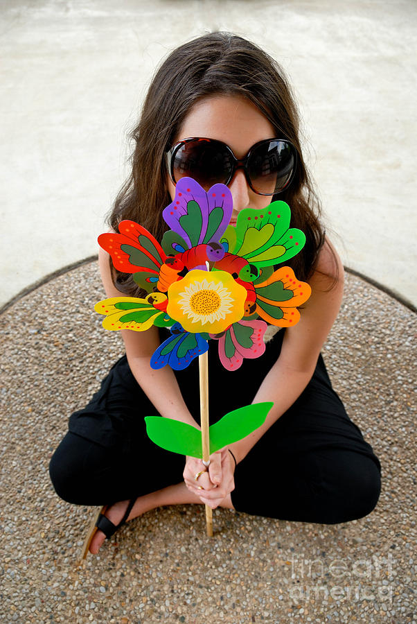 Flowers Still Life Photograph - Teenage Girl Hiding Behind Toy Flower by Amy Cicconi