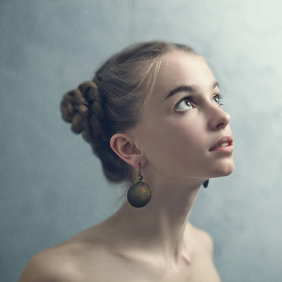 Teenage girl with braided hair wearing dangling earrings Photograph by Vladimir Serov