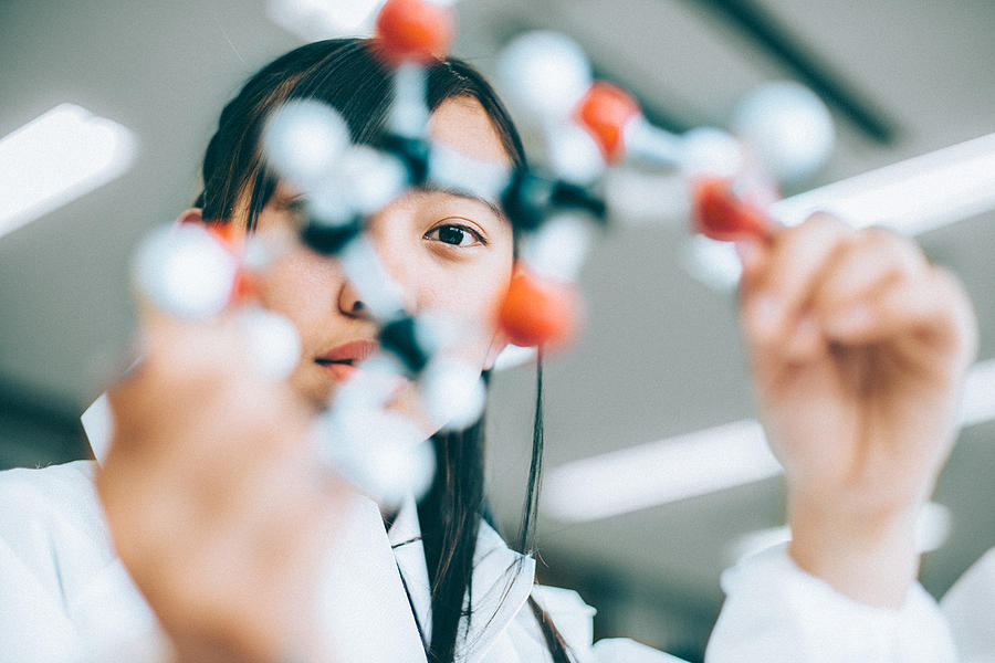 Teenage Student in Chemistry Lab Photograph by Ferrantraite