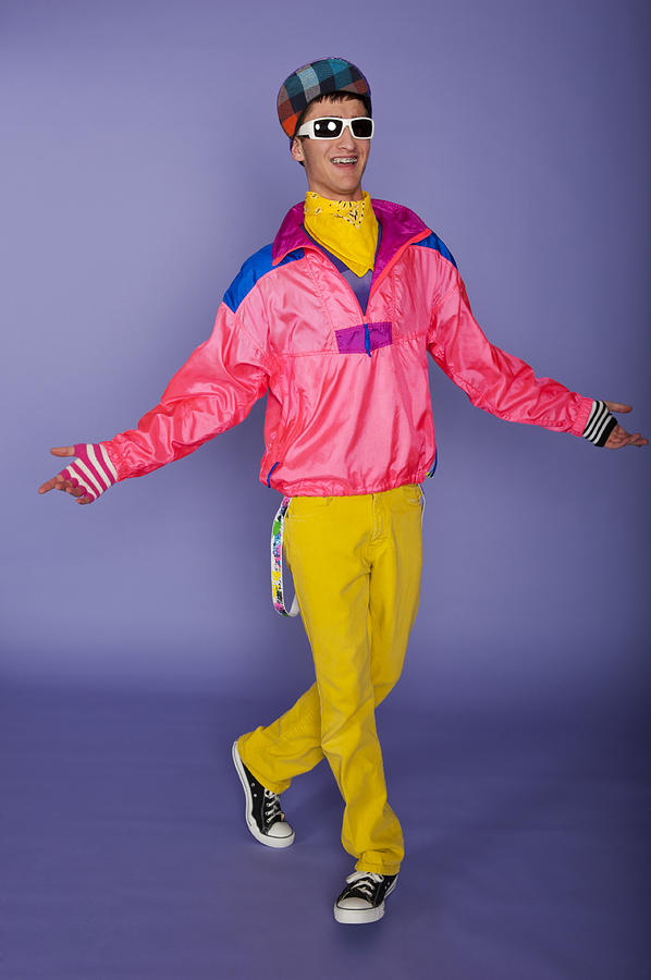 Teenager in 1980s fluorescent pink and yellow with cap Photograph by Jason_V