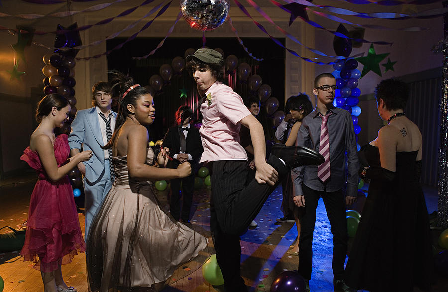 Teenagers dancing together at prom Photograph by Jupiterimages