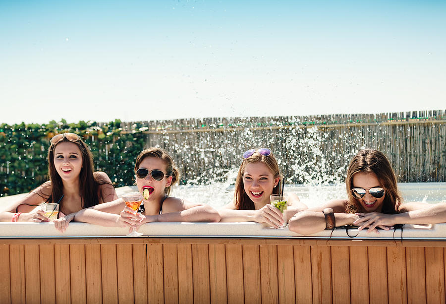 Teenagers Having Fun In hot tub Photograph by Borchee