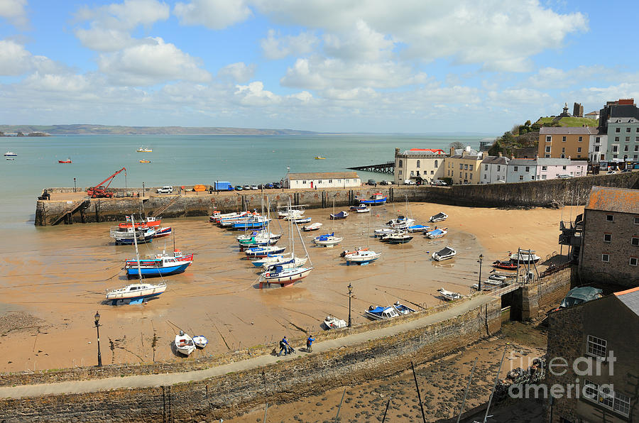 Tenby harbour at low tide Photograph by Paul Cowan