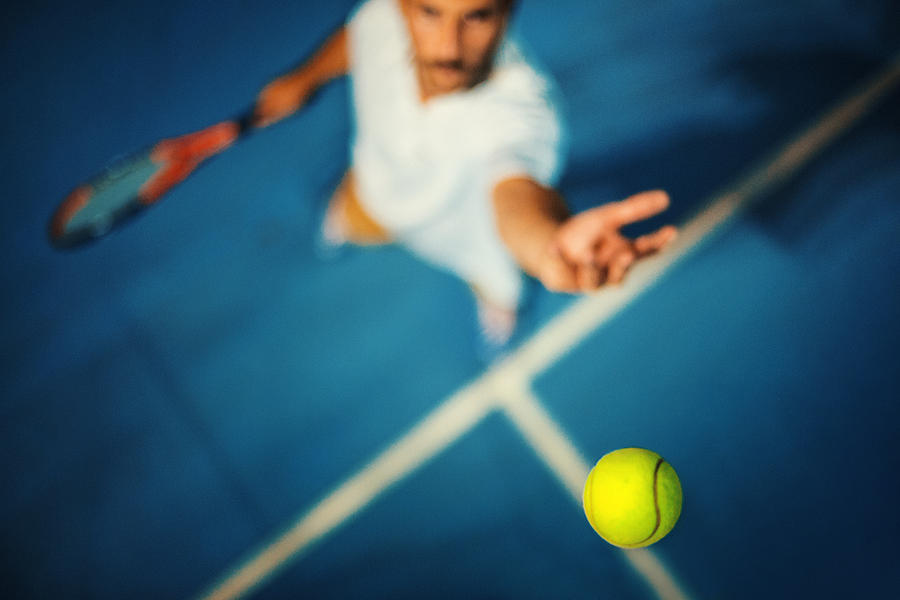 Tennis serve. Photograph by Gilaxia