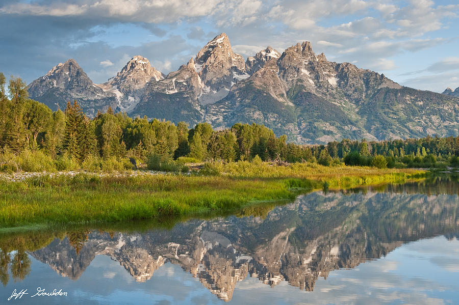Teton Range Reflected in the Snake River Photograph by Jeff Goulden