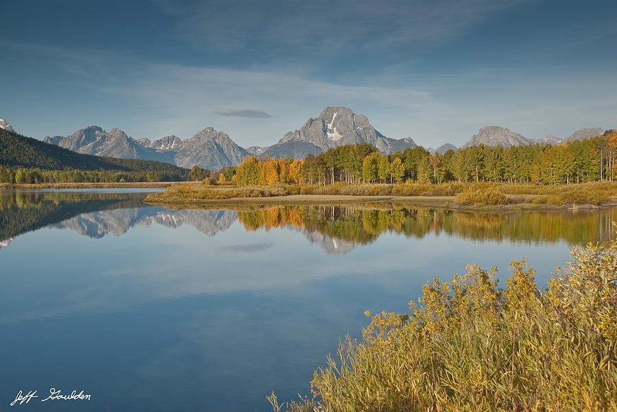 Tetons and Fall Colors Reflected in the Snake River Photograph by Jeff Goulden
