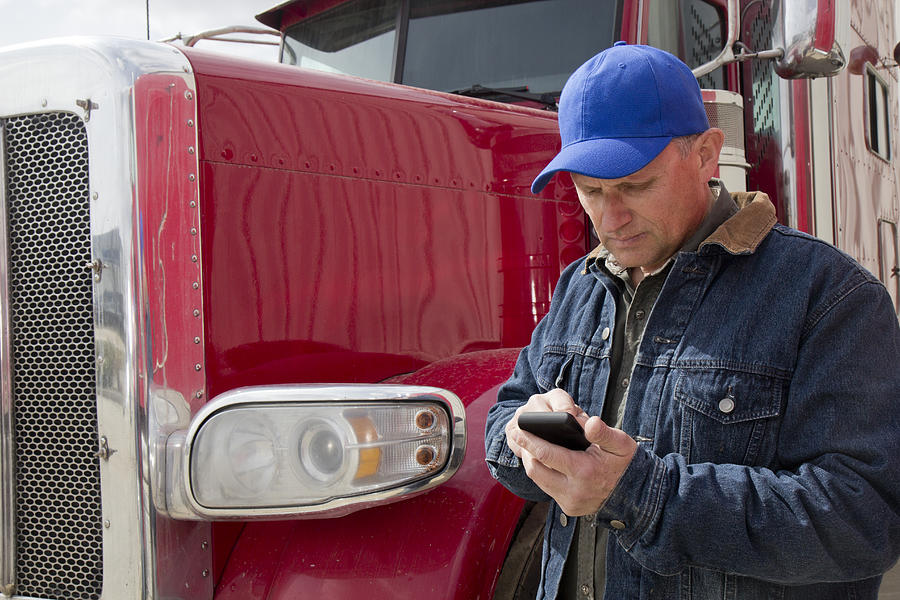 Texting Truck Driver Photograph by Shotbydave