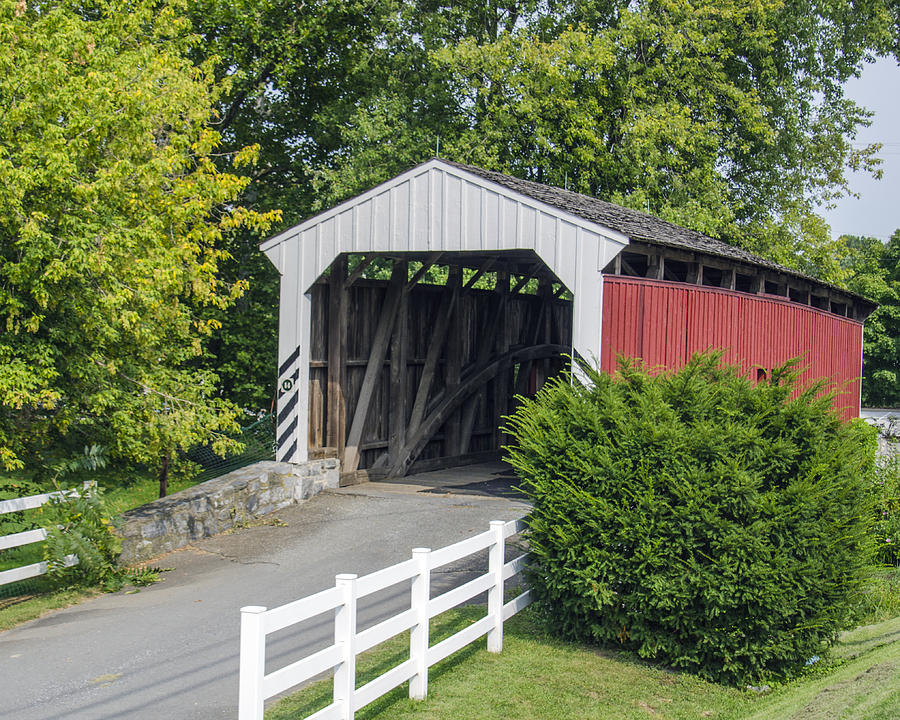 The Amish village covered bridge. Photograph by Dave Sandt