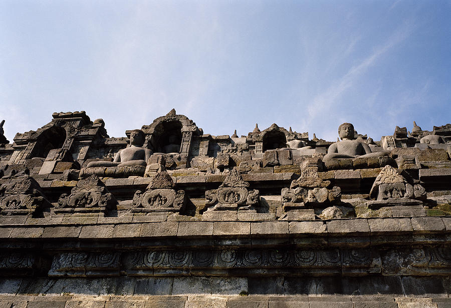 The Ancient Sublime Buddhas Of Borobudur Photograph by Shaun Higson