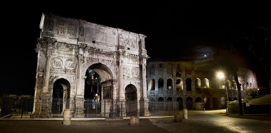 The Arch of Constantine and the Colosseum at night Photograph by Weston Westmoreland