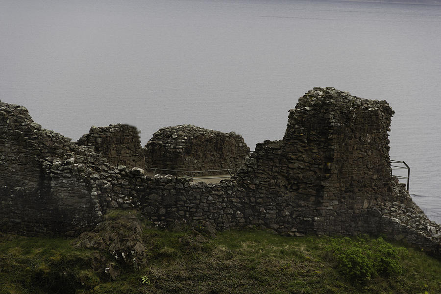 The Battered Remains Of The Urquhart Castle In Scotland Photograph