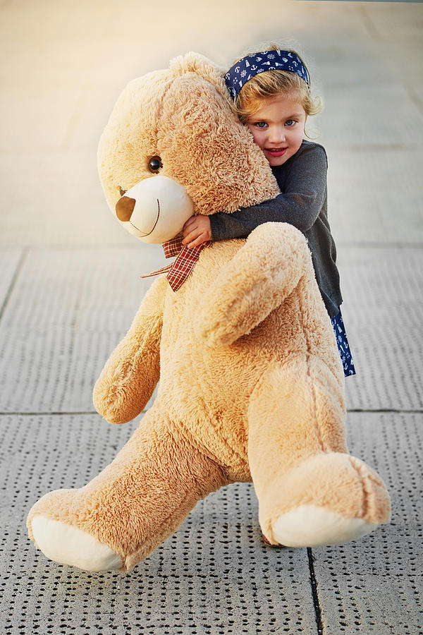 The bigger the bear, the bigger the cuddles Photograph by Peopleimages