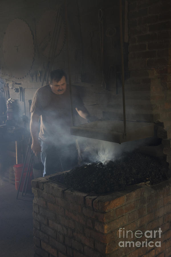 The Blacksmith at Work Photograph by Daniel Ryan