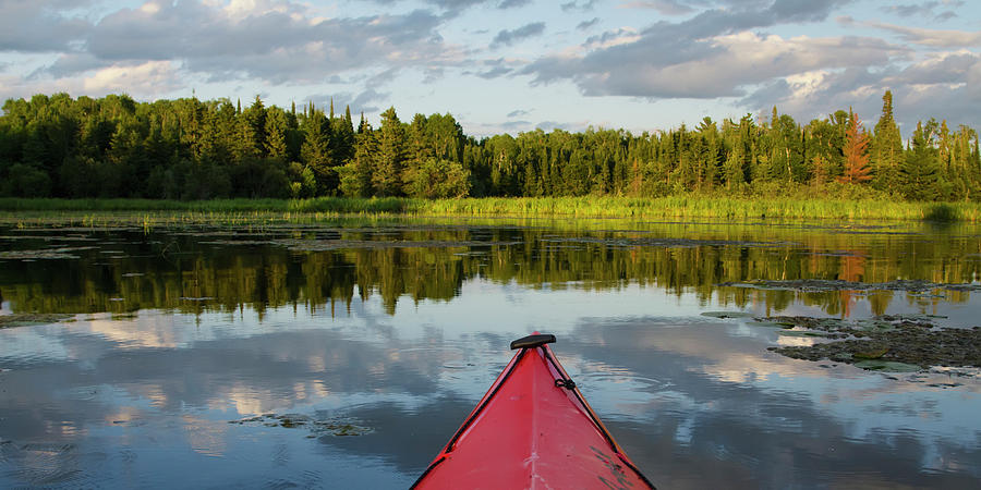 The Bow Of A Red Kayak In A Lake Photograph by Keith Levit / Design Pics