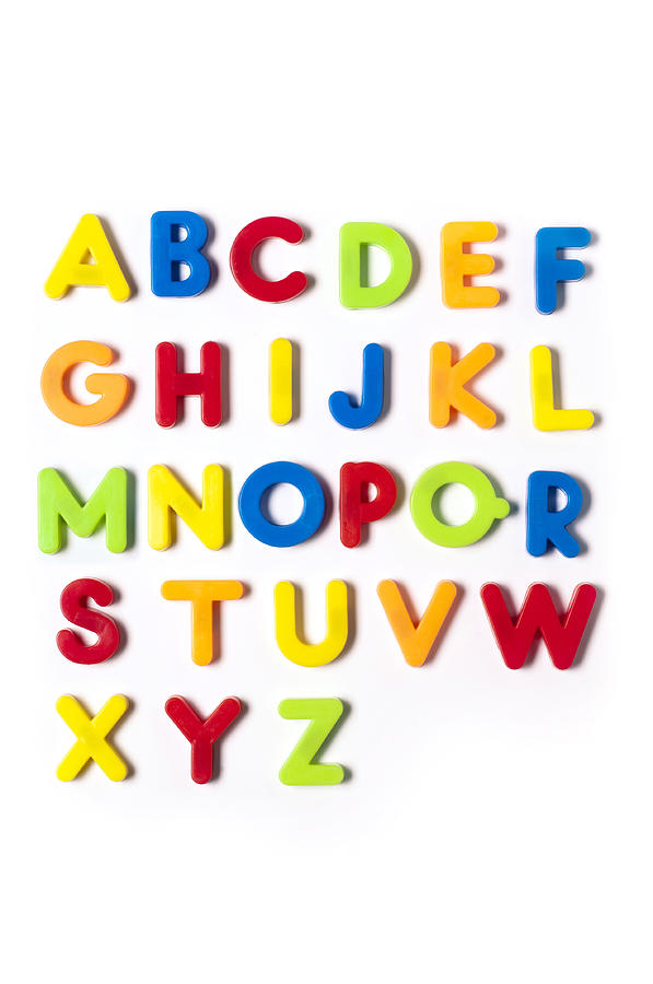 The British alphabet letters in plastic toy characters, white background Photograph by Burakpekakcan