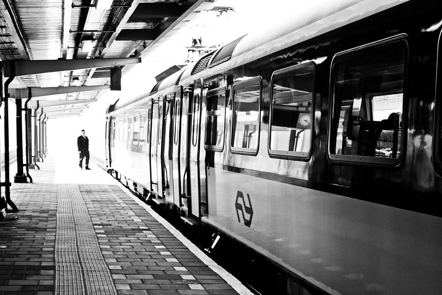 The Conductor's Last Call at the Train Station Photograph by Calvin ...